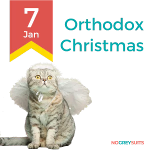 The image displays a graphic for Orthodox Christmas with a whimsical touch. A cat with a curious expression is depicted, wearing a white angelic costume with wings and a halo effect above its head. The cat's fur is a mix of light and dark grey, with distinctive stripes. In the top left corner, there's a red ribbon banner with the date '7 Jan' in white, signifying the date of Orthodox Christmas. The text 'Orthodox Christmas' is written to the right in large, bold font. The phrase 'NO GREY SUITS' is placed at the bottom right in white lettering on a black background.