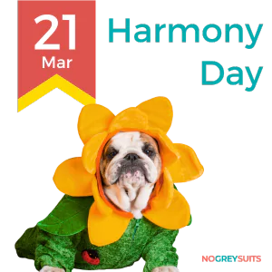 A cheerful graphic for Harmony Day on March 21st, depicting a bulldog dressed in a flower costume. The costume includes a bright orange flower headpiece with petals around the dog's face and a green leafy body suit. The bulldog has a wrinkled face with a gentle expression and is looking forward. The graphic's background features a dark red upper half transitioning to dark teal at the bottom. A yellow and red ribbon on the left bears '21 Mar' in red font. The words 'Harmony Day' are written in large white letters to the right. The phrase 'NO GREY SUITS' is positioned in small white text at the bottom right corner of the image.