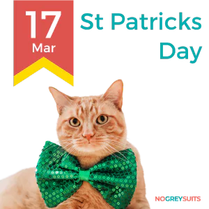 A festive graphic in celebration of St. Patrick's Day on March 17th, featuring an orange tabby cat. The cat is looking directly at the camera with a slightly tilted head, wearing a large green bow tie adorned with sequins, suggesting a festive attire for the occasion. The background is split with a dark red upper portion and a dark teal lower portion. On the left, a yellow and red ribbon design displays '17 Mar' in large red font. 'St Patricks Day' is written on the right in bold white letters. In the bottom right corner, the phrase 'NO GREY SUITS' is included in small white text.